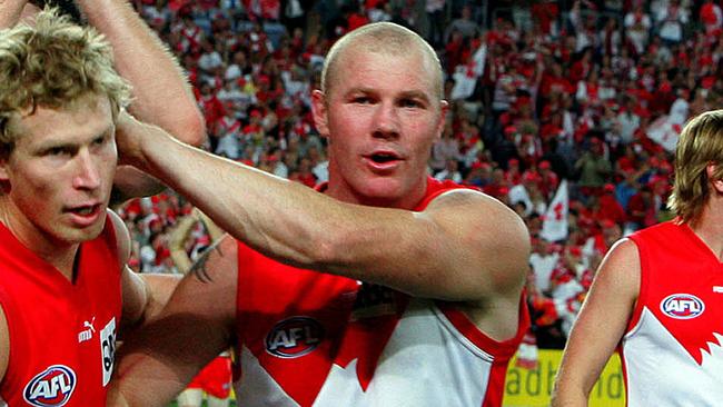 Craig Bolton and Barry Hall of the Swans celebrate after winning the AFL First Preliminary Final between The Sydney Swans and The Fremantle Dockers at Telstra Stadium, Friday, Sept. 22, 2006.The swans won 127-92. (AAP Image/Jenny Evans) NO ARCHIVING, EDITORIAL USE NEWSPAPERS ONLY