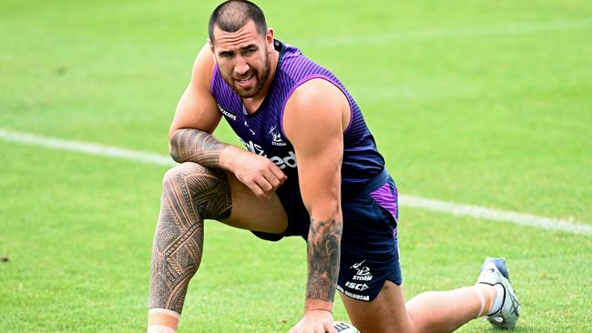 SUNSHINE COAST, AUSTRALIA - SEPTEMBER 29: Nelson Asofa-Solomona stretches during a Melbourne Storm NRL training session at Sunshine Coast Stadium on September 29, 2020 in Sunshine Coast, Australia. (Photo by Bradley Kanaris/Getty Images)