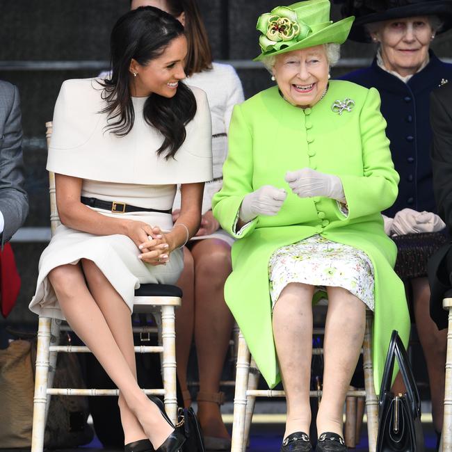 Queen Elizabeth II laughs with Meghan, Duchess of Sussex, during a ceremony to open the new Mersey Gateway Bridge. Picture: Jeff J Mitchell/Getty Images