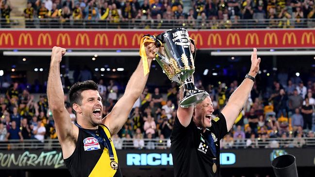 Trent Cotchin and Coach Damien Hardwick hold up the premiership cup after the 2020 AFL Grand Final match between the Richmond Tigers and the Geelong Cats at The Gabba