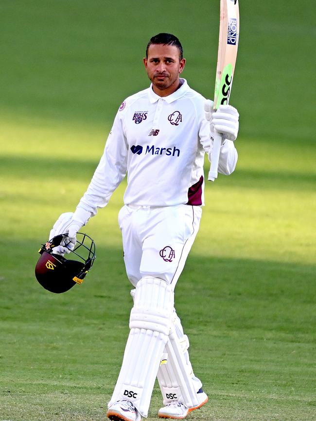 Usman Khawaja of Queensland celebrates after scoring a century during day four of the Sheffield Shield match between Queensland and South Australia at The Gabba.