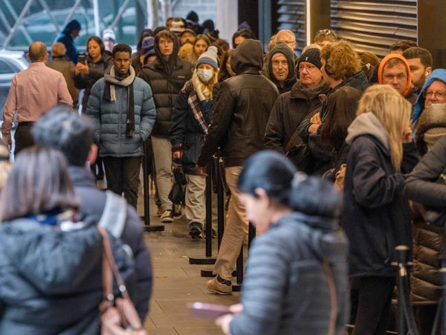 Queues start to build up outside of 747 Collins Square, at Docklands for Passports. Picture: Tony Gough