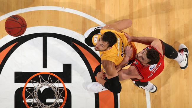 Andrew Bogut (L) and Angus Brandt eye off a rebound. Picture: Getty