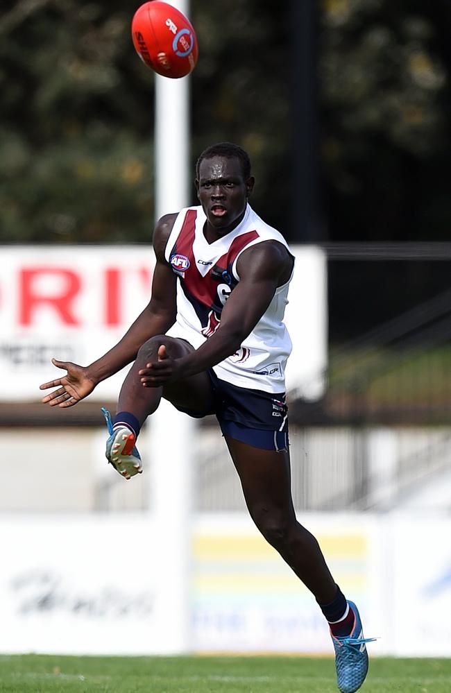 Goy Lok takes a kick for Sandy Dragons in 2016.