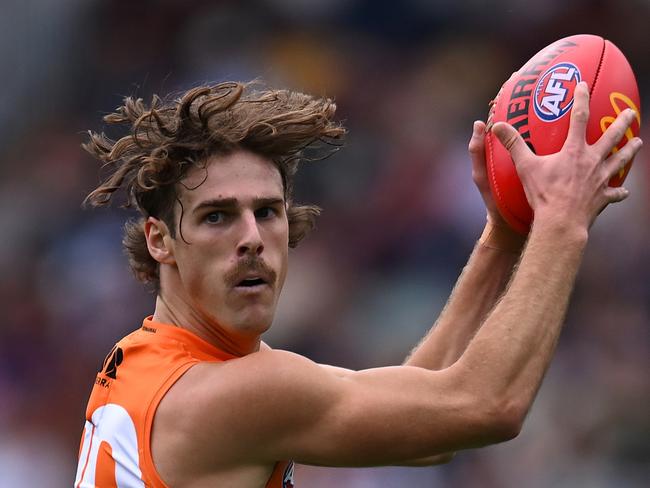 BRISBANE, AUSTRALIA - AUGUST 10: James Peatling of the Giants handles the ball during the round 22 AFL match between Brisbane Lions and Greater Western Sydney Giants at The Gabba, on August 10, 2024, in Brisbane, Australia. (Photo by Albert Perez/AFL Photos via Getty Images)