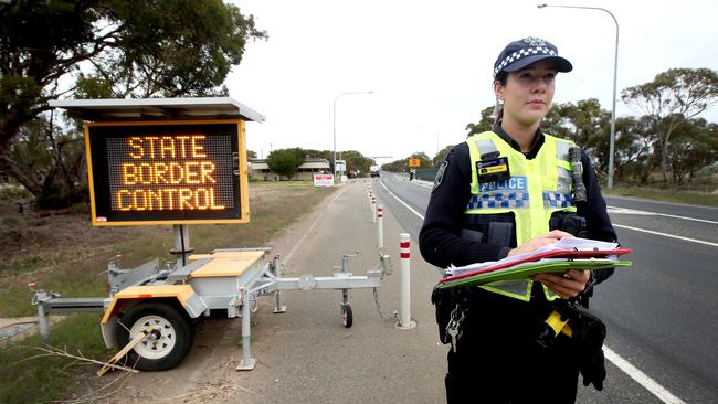 Constable Ashleigh Broadbent at the checkpoint near the SA border, 5km east of Pinnaroo. SA’s borders were not technically closed, but anyone entering had to quarantine for two weeks. Picture: AAP / Kelly Barnes