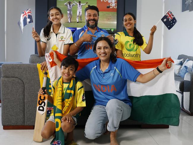 DAILY TELEGRAPH NOVEMBER 21, 2024. From left Zaydyn Dhillon, 7, with his aunty Jaspreet Gill, cousin Ameera Sodhi, 14, dad Randeep Dhillon and his daughter Zahra Dhillon, 13, excited to watch the summer of cricket. The Kellyville Indian families live next door to each other and the dad's generation supports India while the kids support Australia. Picture: Jonathan Ng