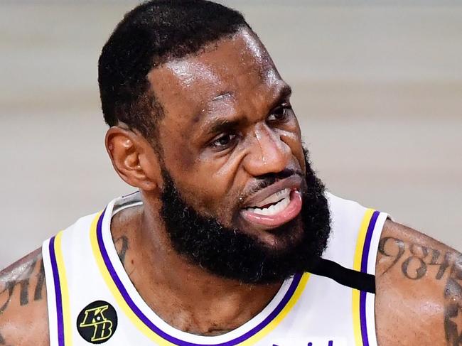 LAKE BUENA VISTA, FLORIDA - OCTOBER 11: LeBron James #23 of the Los Angeles Lakers reacts against the Miami Heat in Game Six of the 2020 NBA Finals at AdventHealth Arena at the ESPN Wide World Of Sports Complex on October 11, 2020 in Lake Buena Vista, Florida. NOTE TO USER: User expressly acknowledges and agrees that, by downloading and or using this photograph, User is consenting to the terms and conditions of the Getty Images License Agreement.   Douglas P. DeFelice/Getty Images/AFP == FOR NEWSPAPERS, INTERNET, TELCOS & TELEVISION USE ONLY ==