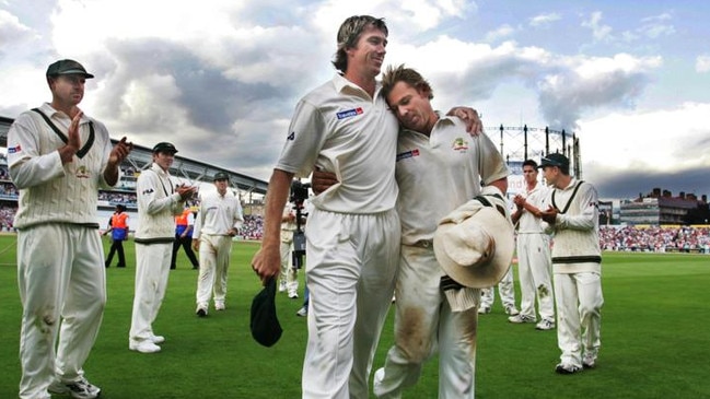 Glenn McGrath (left) and Shane Warne embrace in 2005 as they leave the field for the last time in an Ashes series in England. Picture: Phil Hillyard.