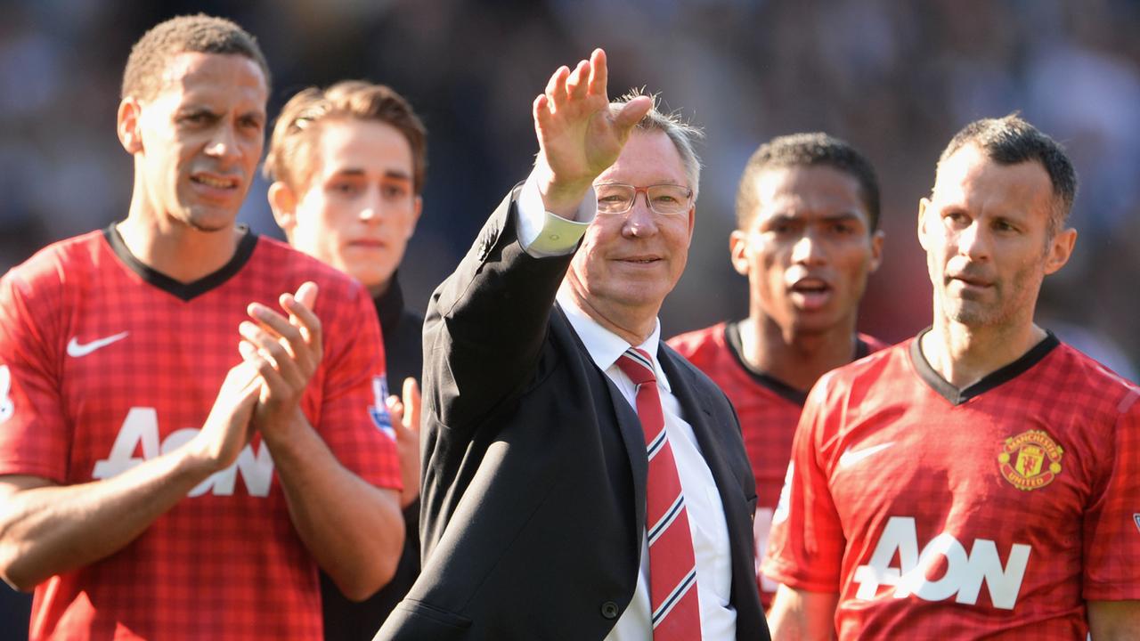 WEST BROMWICH, ENGLAND - MAY 19:  Manchester United manager Sir Alex Ferguson is applauded by players Rio Ferdinand and Ryan Giggs after his 1,500th and final match in charge of the club following the Barclays Premier League match between West Bromwich Albion and Manchester United at The Hawthorns on May 19, 2013 in West Bromwich, England.  (Photo by Michael Regan/Getty Images)