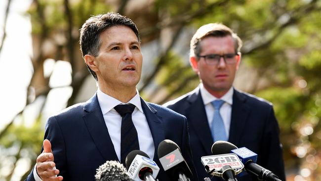 NSW Customer Service Minister Victor Dominello, left, and NSW Treasurer Dominic Perrottet, right, are privately blaming each other for JobSaver failures. Picture: AAP