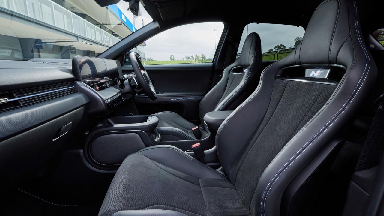 Bucket seats with leather and Alcantara trim, along with metal pedals featuring pixel flag rubber grips and a chunky sports steering wheel adorned with paddle shifters are among the interior features of the Hyundai Ioniq 5N.