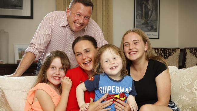 Jane Garrett at home with husband James Higgins and their children — Sasha, Max and Molly. Picture: David Caird