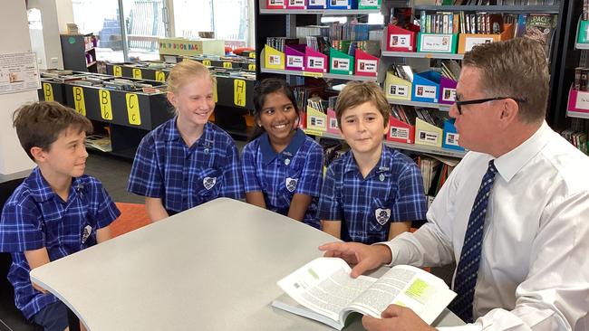 Eagle Junction principal Adam Mathewson with students. Picture: EJSS