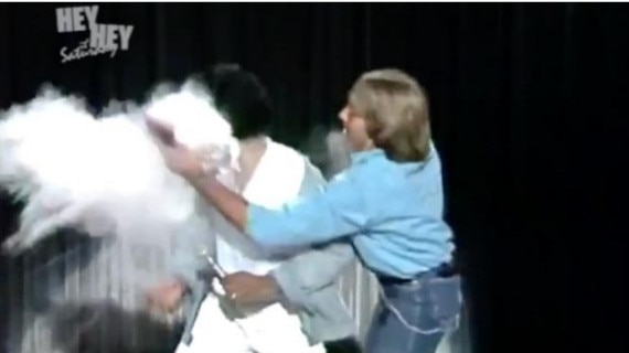 Kamahl gets ambushed with a pie to the face during a musical performance.