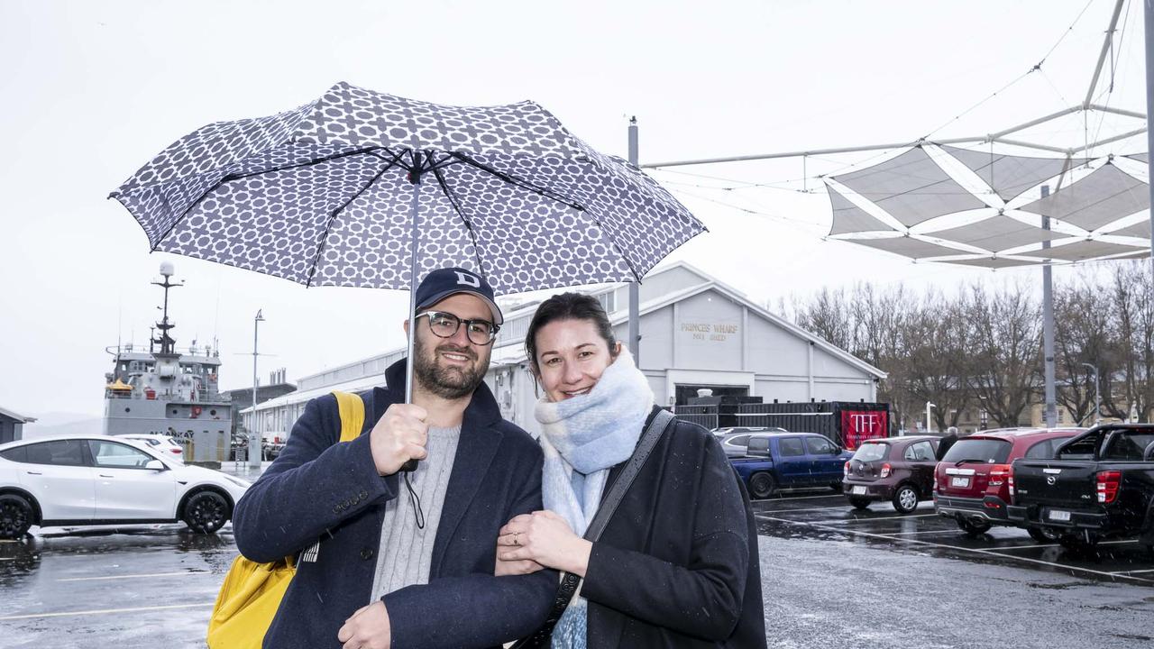 Tasmania Wet Weather - David and Kats Cali at Salamanca. Picture: Caroline Tan