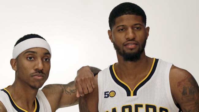 Indiana Pacers' Jeff Teague, left, poses with Paul George.