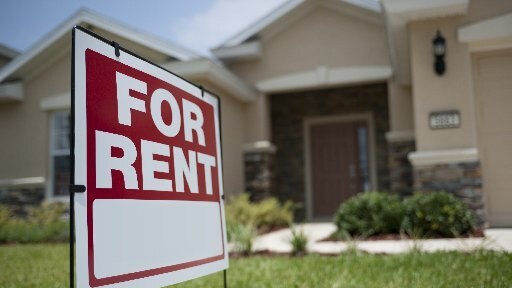 For Rent sign in front of new house