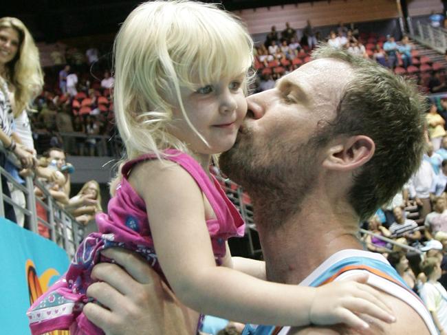 Jess Petrie with her dad after an NBL game.