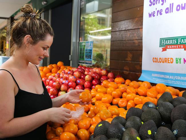 SYDNEY, AUSTRALIA -  Newswire Photos MARCH 14 2023 - A member of the public is seen buying produce and groceries in Sydney as the Cost of living continues to rise. Picture: NCA Newswire / Gaye Gerard.