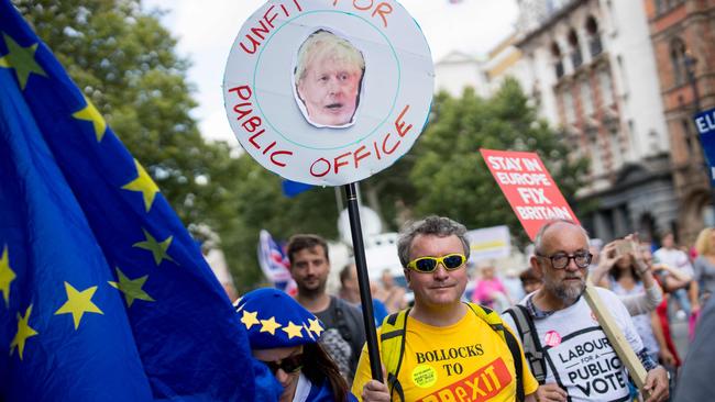 Anti-Brexit campaigners carry placards during the March for Change No to Boris: Yes to Europe demonstration in London. Picture: AFP