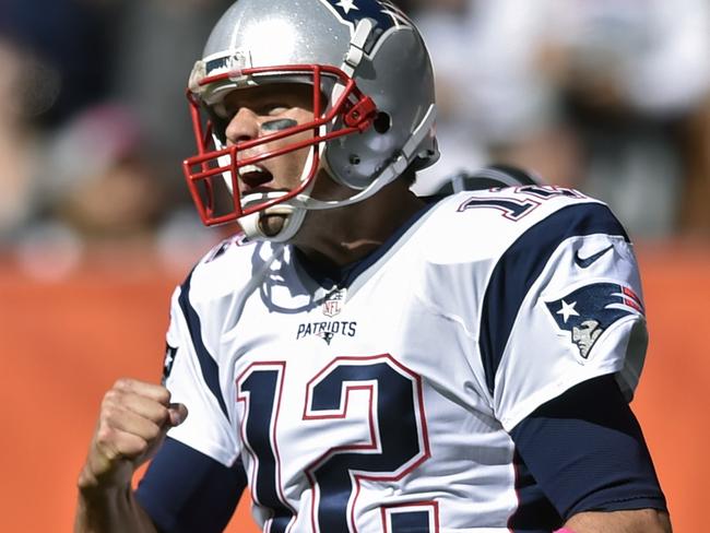 New England Patriots quarterback Tom Brady celebrates a touchdown in the first half.