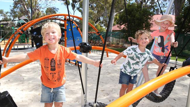 Young friends play at the new playground at Civic Park in Modbury. Picture: Stephen Laffer