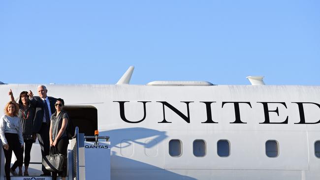 Mike Pence with wife Karen and daughters Charlotte (left) and Audrey (right) as they board an aircraft before departing Sydney International Airport in Sydney on Monday. Picture: Paul Miller/AAP.