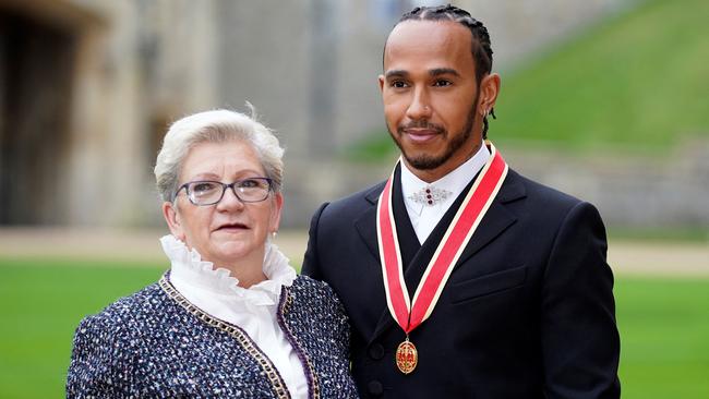 His mother Carmen Lockhart was with him to celebrate the occasion. Photo: Andrew Matthews/POOL/AFP