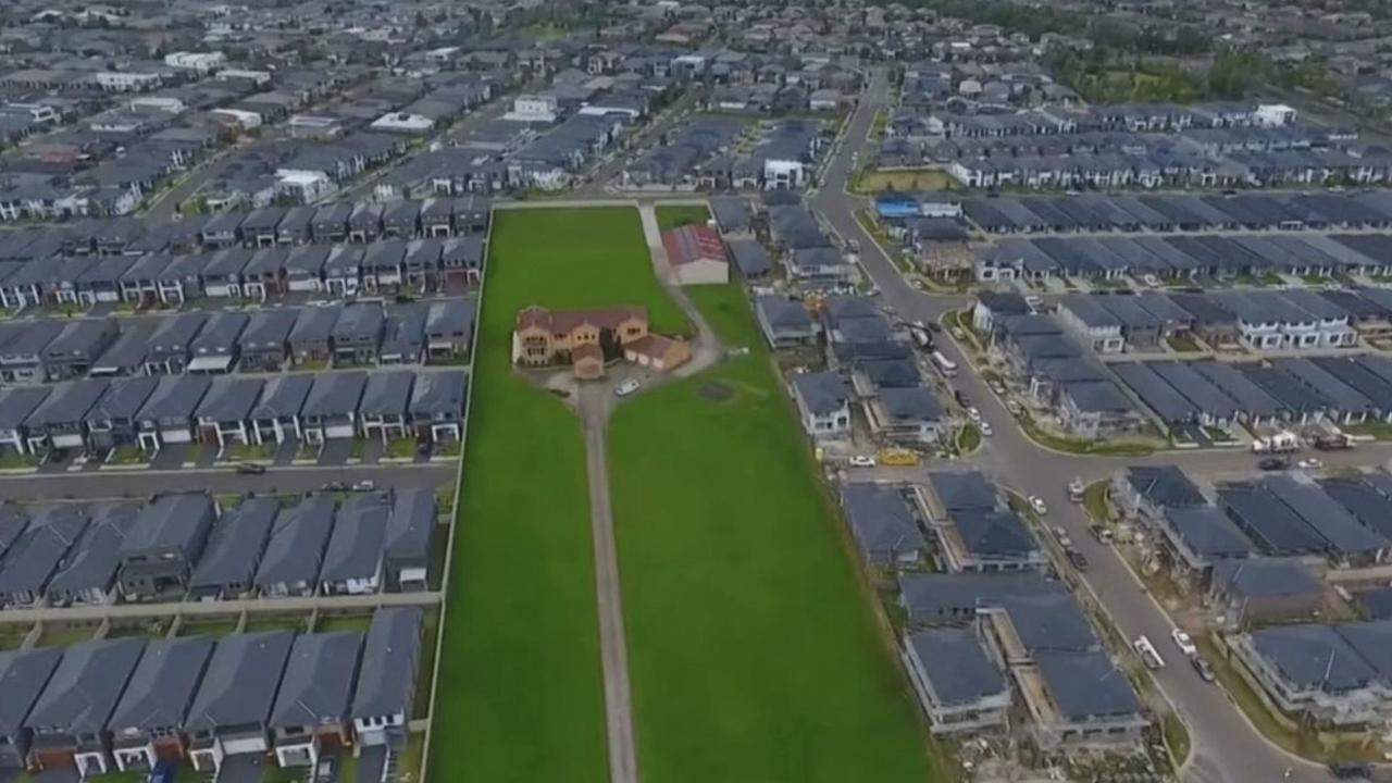 Drone shots of the property really show how much it stands out among the lines of grey two storey homes. Picture: Seven News