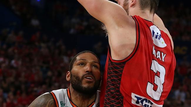 PERTH, AUSTRALIA — DECEMBER 09: DJ Newbill of the Taipans drives to the basket against Nicholas Kay of the Wildcats during the round eight NBL match between the Perth Wildcats and the Cairns Taipans at RAC Arena on December 09, 2018 in Perth, Australia. (Photo by Paul Kane/Getty Images)