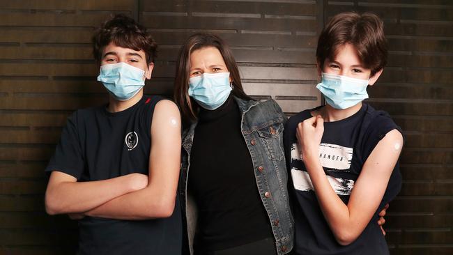 Angelique Ferguson, of Hobart, with her sons Joseph, 15, and Thomas, 13, who had their first Pfizer vaccination at the PW1 clinic last month. Picture: Nikki Davis-Jones