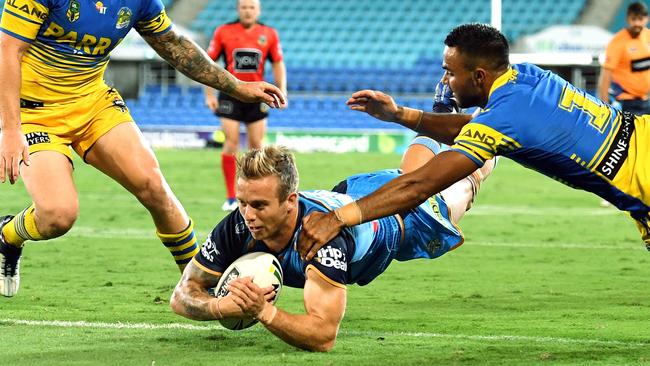 Kane Elgey crosses the line for the Titans.