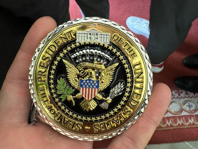 Joe McGuire was presented with a medal after meeting Donald Trump at the White House. Picture: Supplied