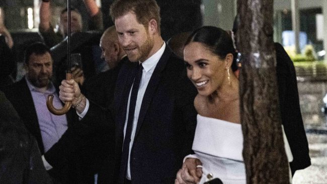 Meghan Markle steps out in off the shoulder Louis Vuitton gown to ...