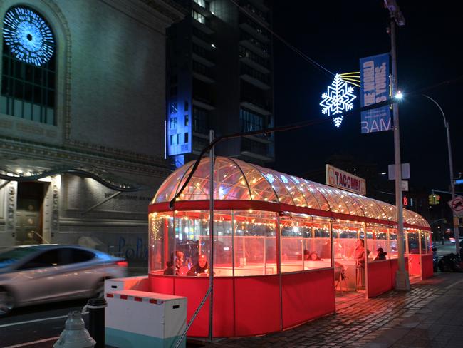 Diners in an outdoor restaurant in the Brooklyn borough of New York City. Picture: Getty Images