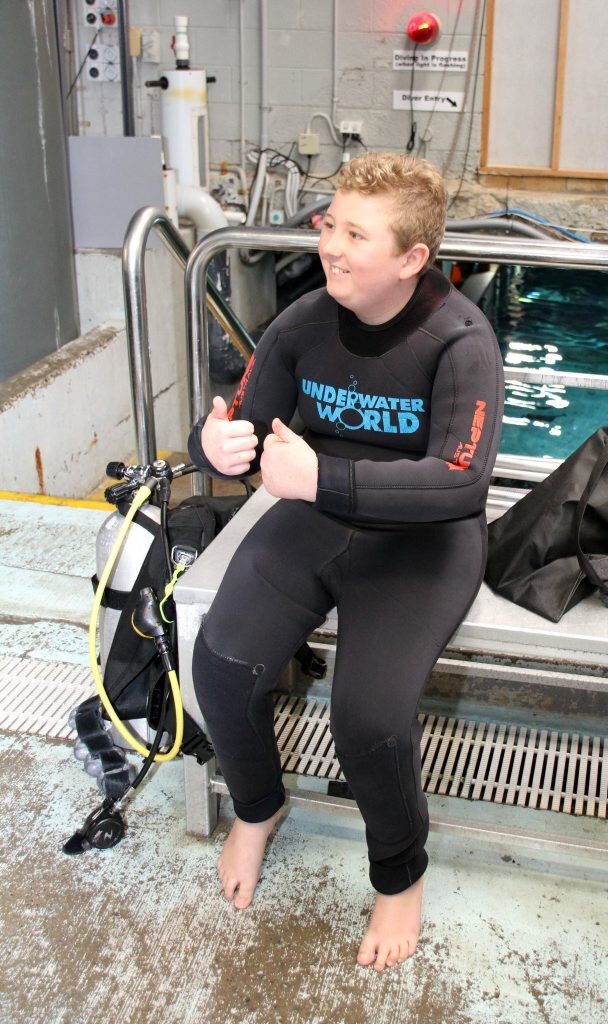 Colby Speare recently spent 506 consecutive days in hospital fighting leukemia. He missed birthdays and Christmas. His parents along with Merlin's Magic Wand have given him a birthday surprise of swimming with the sharks at Sea Life Mooloolaba. Colby suiting up for his big swim Photo: Pete Evans / Sunshine Coast Daily. Picture: Pete Evans