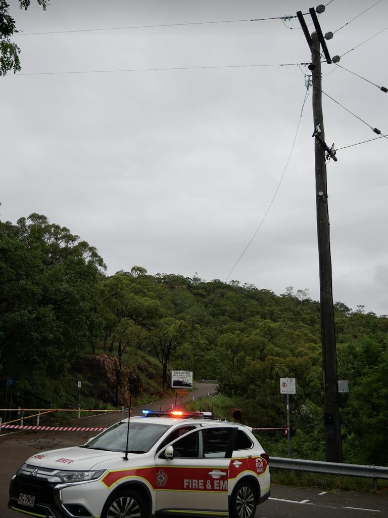 Emergency services don't know yet what state Castle Hill is in after TC Kirrilly hit Townsville, because a power line is lying across the road at the foot of the ascent. Photo: Blair Jackson