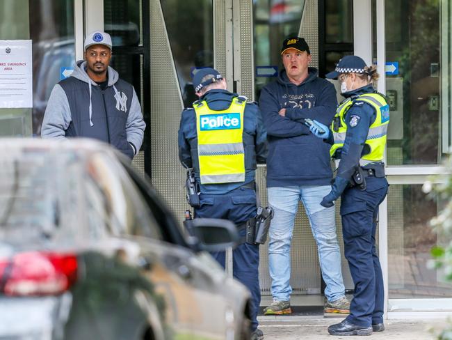 Police at the North Melbourne public housing tower that has been locked down. Picture: Tim Carrafa