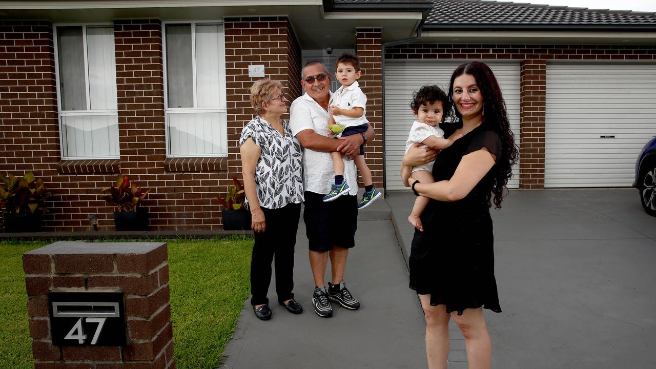 Real estate experts are noticing a trend in young Sydney house hunters getting help from the 'bank of mum and dad'. Mary with her children Ezekiel and Jasmine and parents-in-law Francisco and Maria. Picture: Toby Zerna