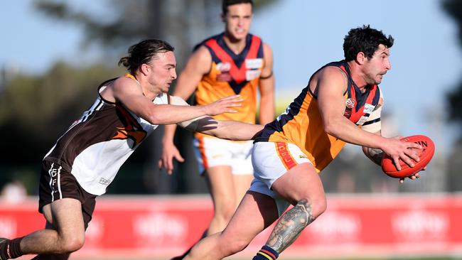 Craigieburn’s Josh Vilinskis puts pressure on East Keilor’s Con Grampsas. Picture: Andy Brownbill