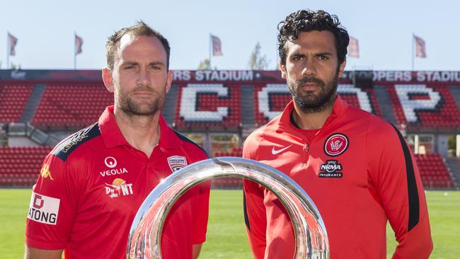 Captains Eugene Galekovic and captain Nikolai Topor-Stanley with the grand final trophy.