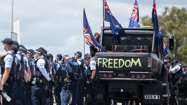 AFP Officers protect the entrance to Parliament House at a demonstration against Covid vaccine mandates at Parliament House, Canberra. Picture: NCA NewsWire / Martin Ollman