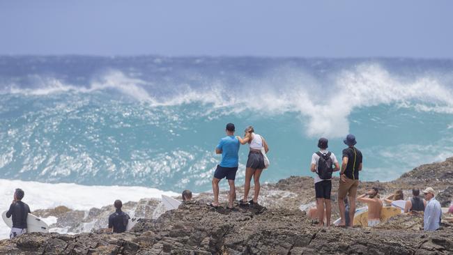 The crowds watching surfers at Snapper Rocks on Sunday 2 January 2022. Picture: Jerad Williams