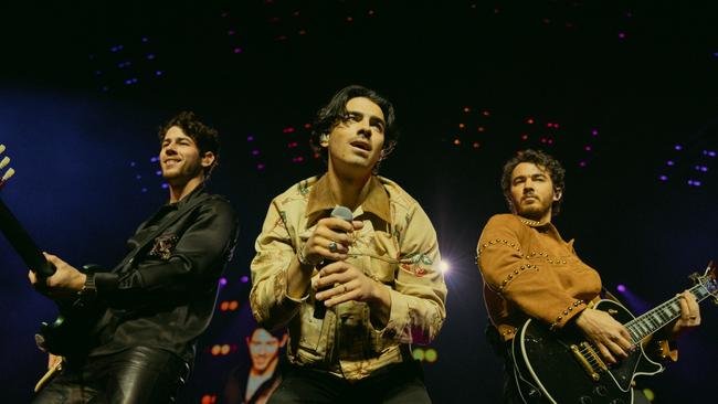 The Jonas Brothers, Nick, Joe and Kevin, to finally tour Australia in 2024. Picture: Miles Leavitt / Supplied.