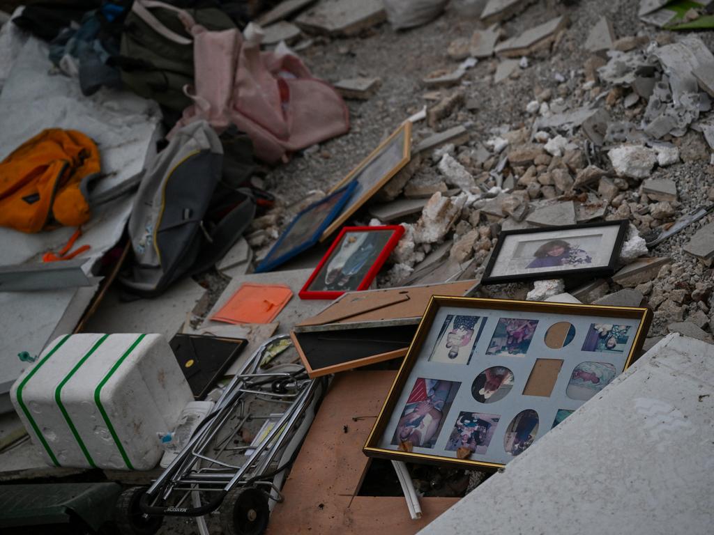 Family photos and personal items are scattered among the rumble of a destroyed house near the border with Gaza on October 11, 2023 in Be'eri, Israel. Picture: Getty