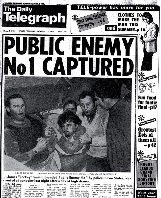 The front page of The Daily Telelgraph on September 15, 1977, shows Edward ‘Jockey’ Smith (centre) being escorted by detectives into the Nowra police station after a dramatic manhunt in 1977.