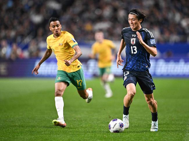 Japan's Keito Nakamura controls the ball during the FIFA World Cup 2026 Asian zone qualifiers football between Japan and Australia at Saitama Stadium in Saitama on October 15, 2024. (Photo by Philip FONG / AFP)