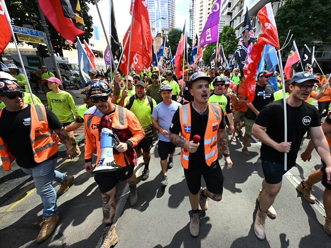 Hundreds of workers walked off the job today in Brisbane in protest of wage theft, sham contracting and insolvency causing a CBD traffic nightmare., Organisers CFMEU. The angry mob converged on the Waterfront Place where they wrote profanities on the windows and smashed a glass door. Police were quick to move the crowd away from the front of the building and the broken glass. The Waterfront Place is where the office of the Federal Government is located - photo Lyndon Mechielsen