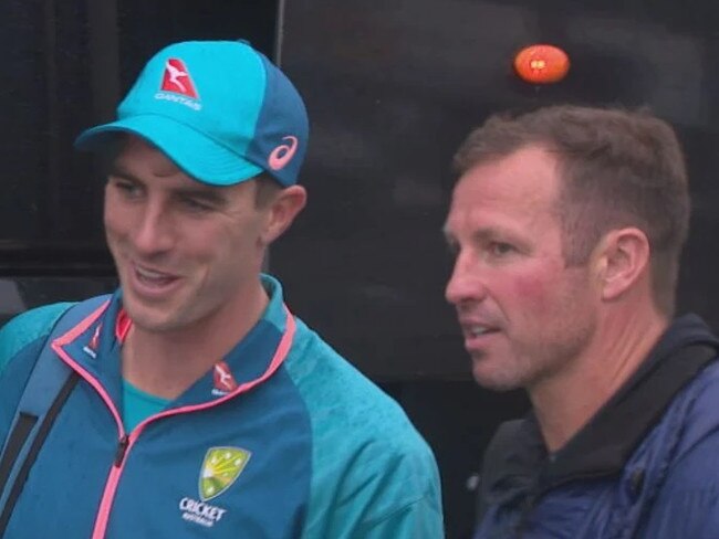 Former Socceroo Lucas Neill alongside Australian Test captain Pat Cummins after day five at Old Trafford.